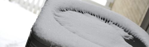 Fresh snow on top of a heat pump