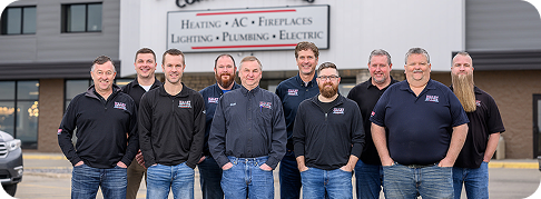 Haley employees smiling for a group photo in front of a building