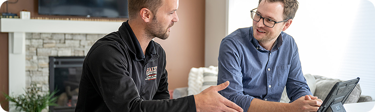 worker talking to customer about HVAC options