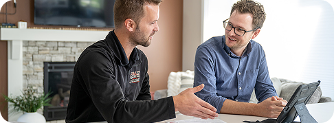 worker talking to customer about HVAC options