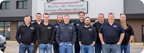 Haley employees smiling for a group photo in front of a building